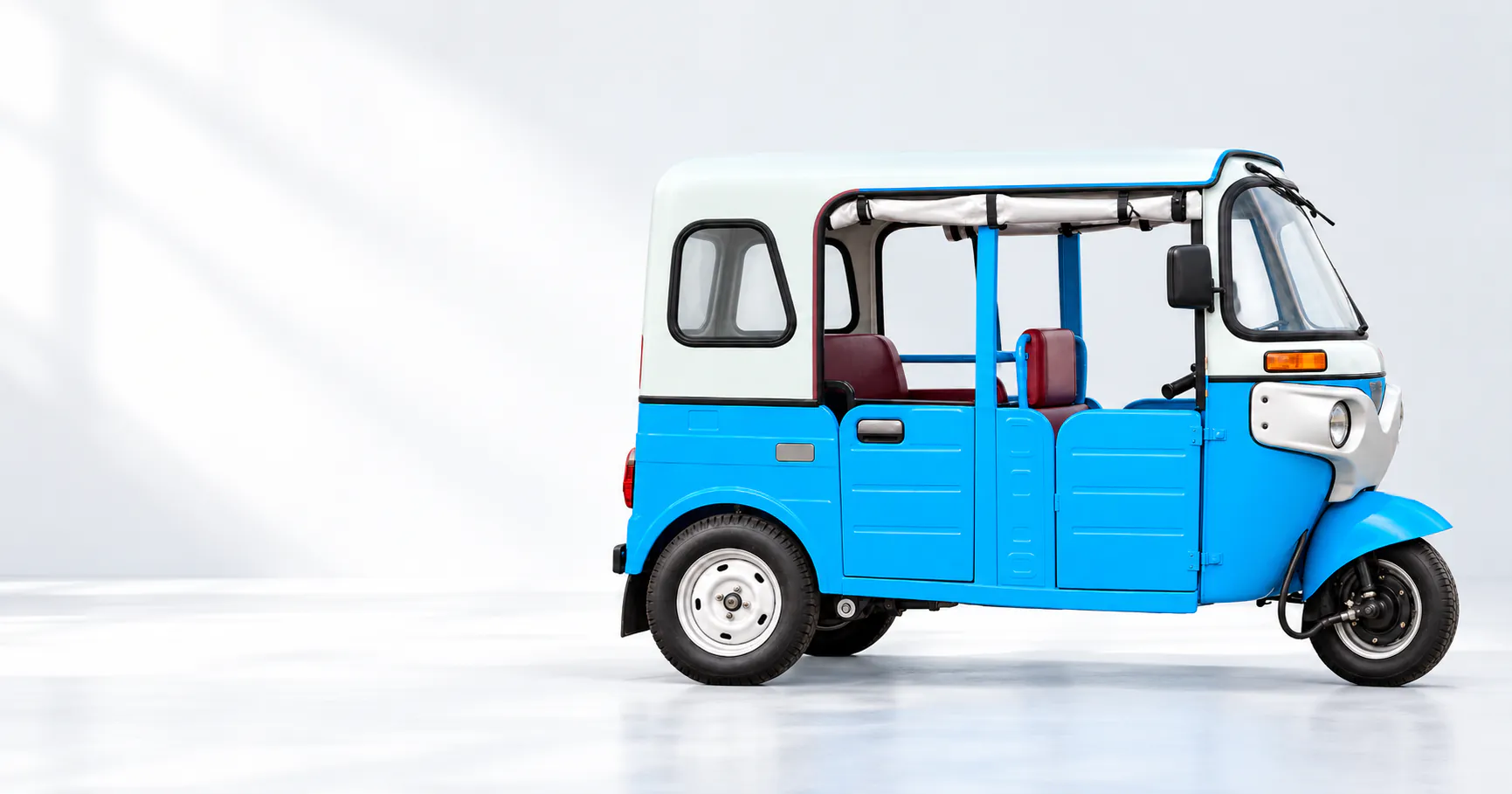 Torrit EV electric three-wheeler in a studio